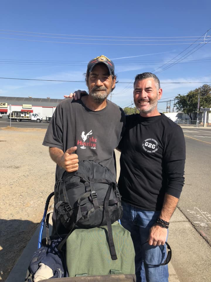 Tracey delivering a sea bag to a veteran in need